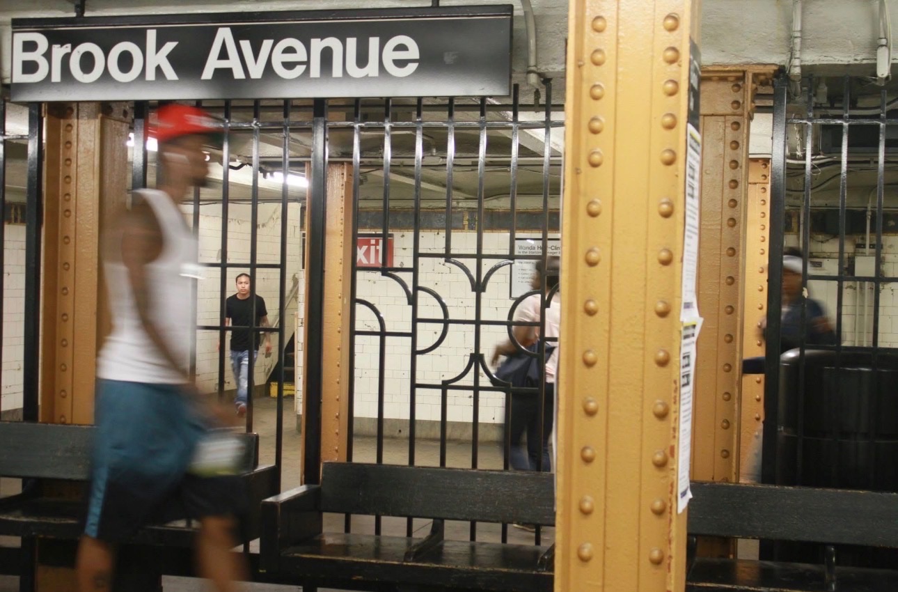 Commuters in motion at the Brook Avenue subway station