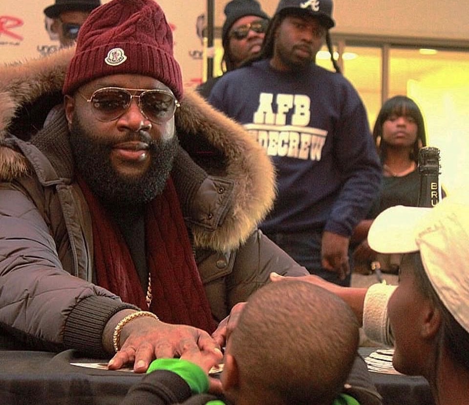 Documentary photograph of an artist greeting young guests at a cultural event